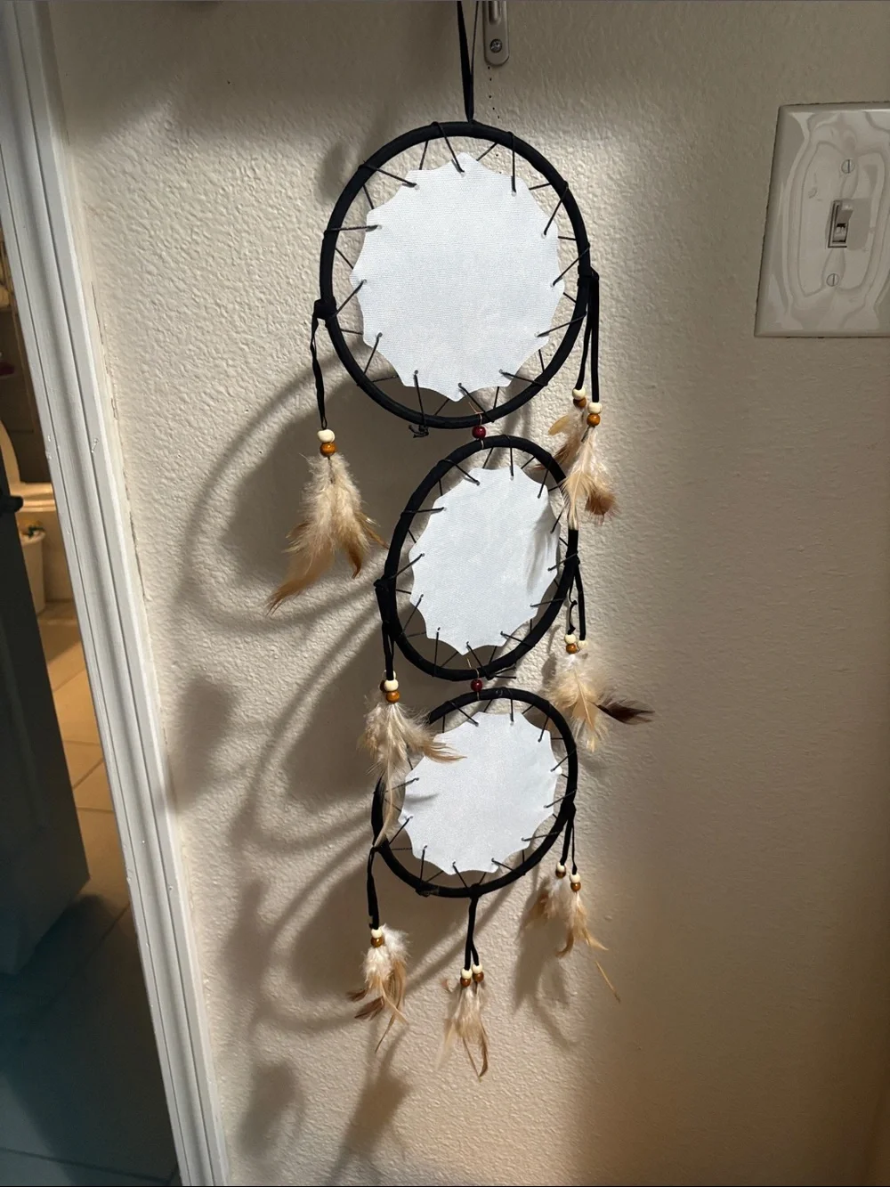 Black Triple Hoop Dreamcatcher Wall Decor with Feather Accents